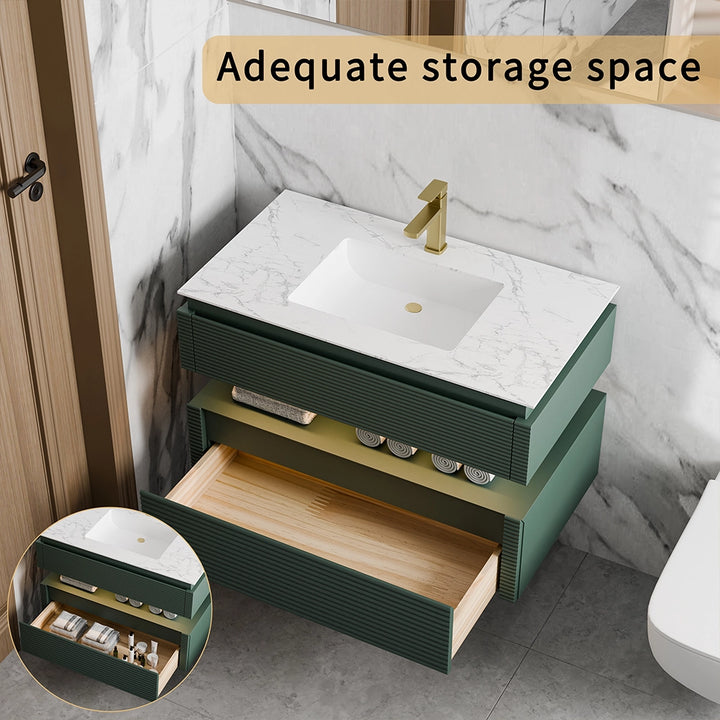 Green bathroom vanity with marble top and large storage drawers