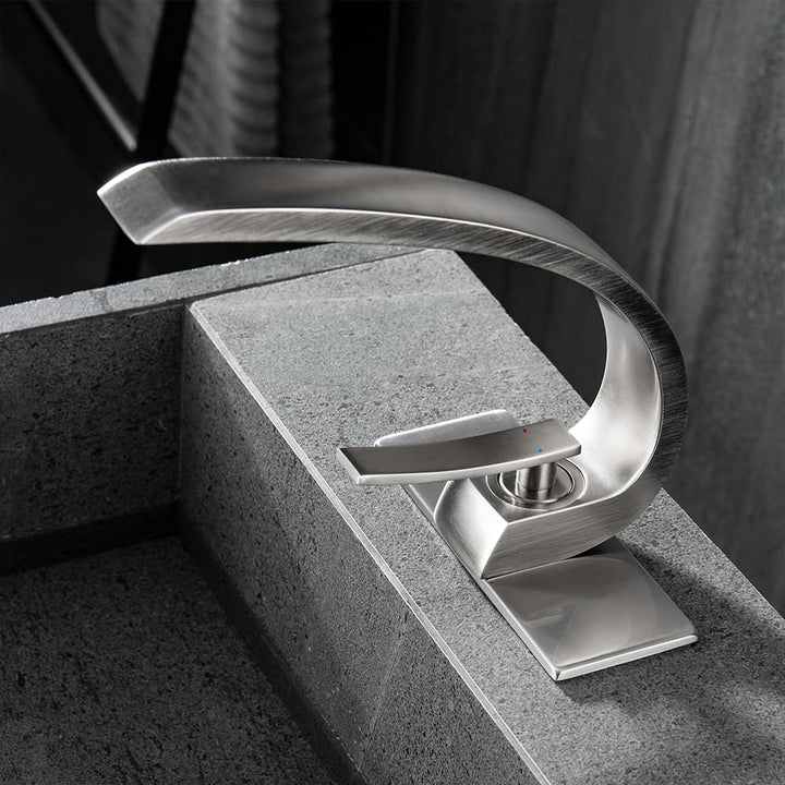 Brushed nickel bathroom faucet modern design on stone sink