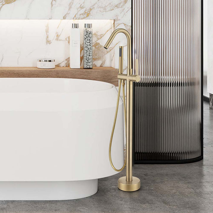 Freestanding gold bathtub faucet in modern bathroom