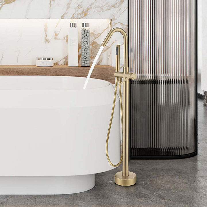Gold freestanding bathtub faucet with water running