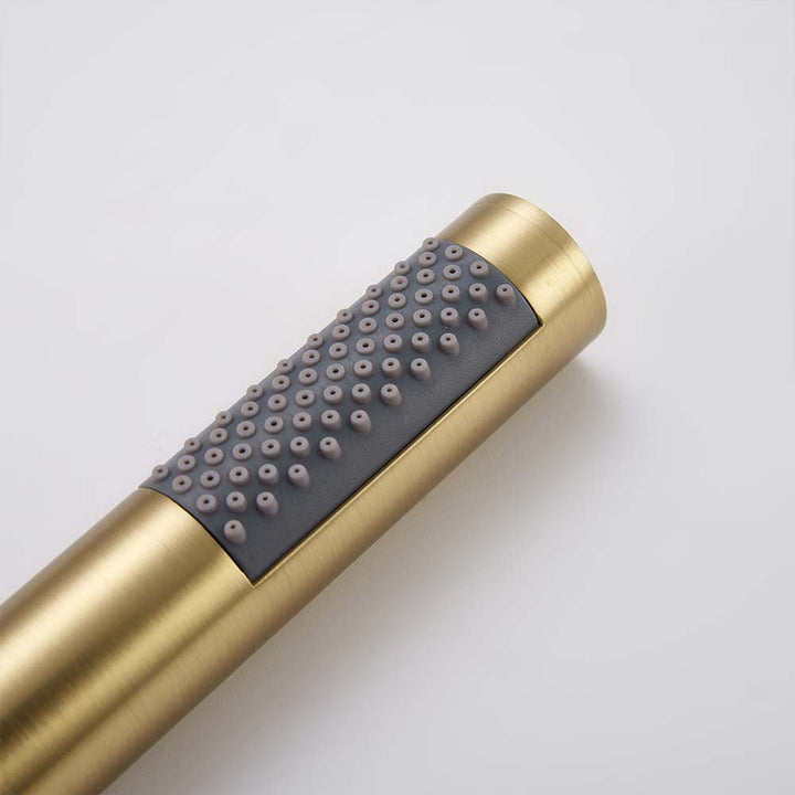 Gold handheld shower head close-up with nozzles