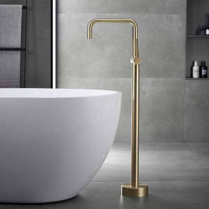 Square spout gold bathtub faucet in modern bathroom