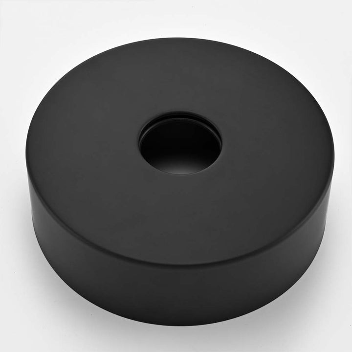 Black base plate for outdoor shower with circular hole design