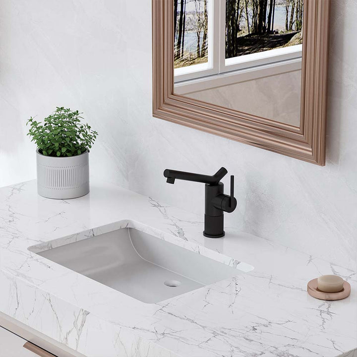 Matte black bathroom faucet on marble countertop sink