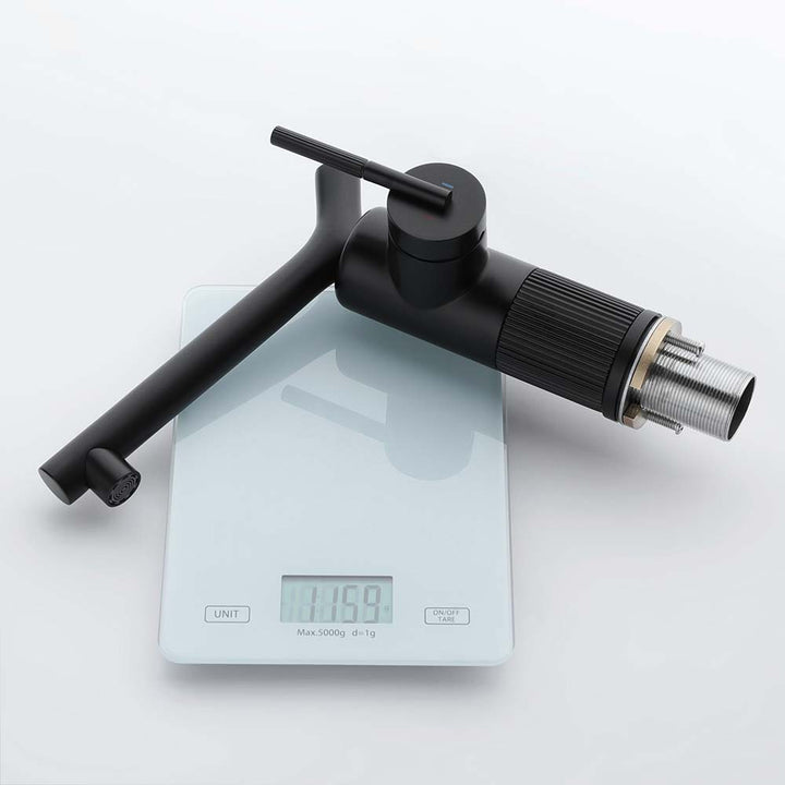 Matte black bathroom faucet weighs 1159g on digital scale