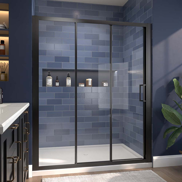 Black-framed sliding shower door with clear glass and blue tile wall.