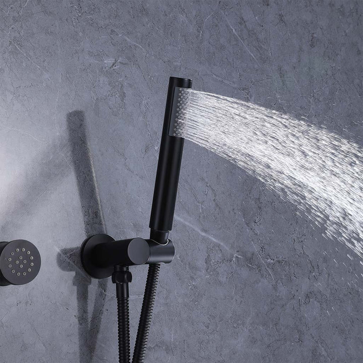 Black handheld shower head spraying water, modern bathroom wall mounted design