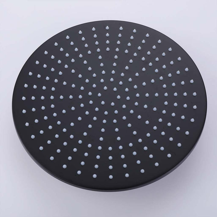 Black round rainfall shower head detail with silicone nozzles