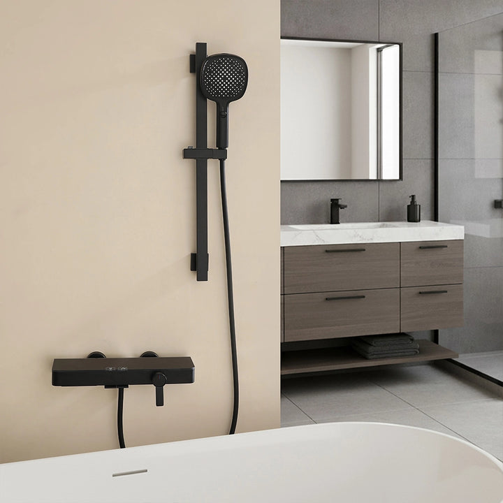 Black shower system mounted by bathtub in modern bathroom