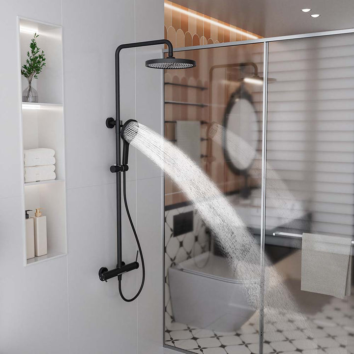 Black shower system with handheld shower spray in modern bathroom