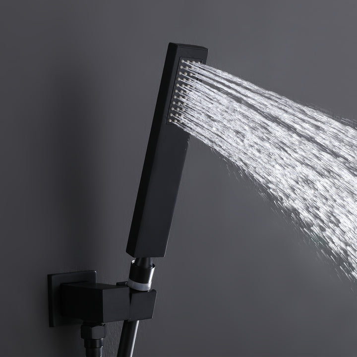 Black shower system handheld shower head spraying water