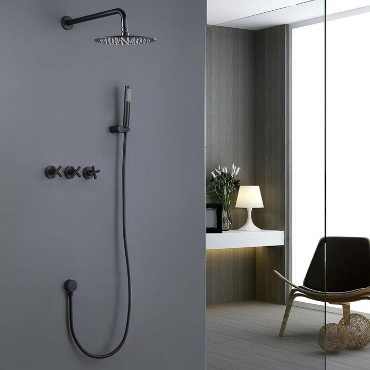 Matte black shower system with handheld sprayer and wall controls