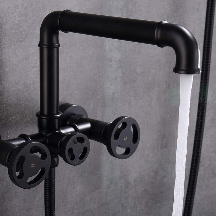 Black industrial-style tub faucet with water flowing