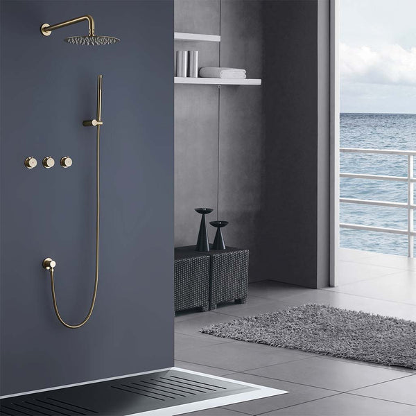 Brushed gold shower system installed in modern bathroom with ocean view