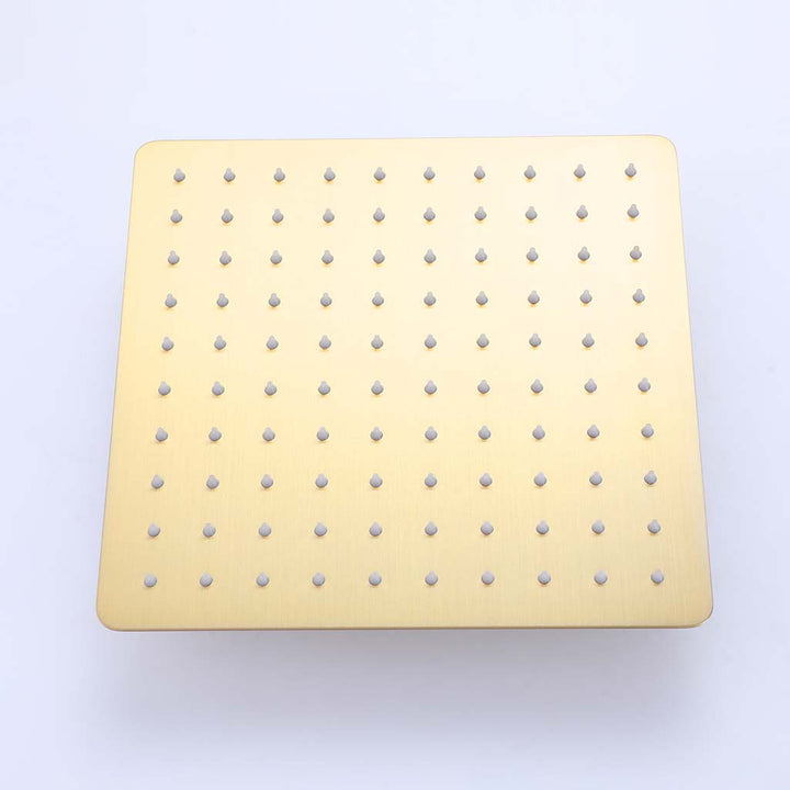 Brushed gold square shower head front view with anti-clog silicone nozzles