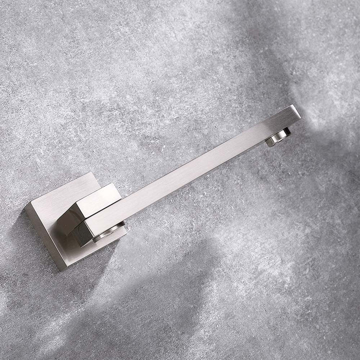 Close-up of brushed nickel bathtub faucet spout on wall