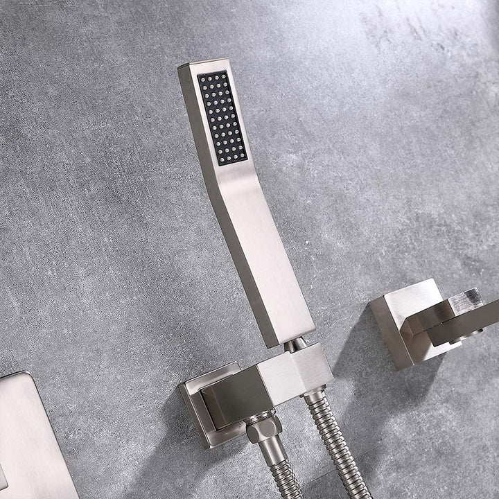 Close-up of brushed nickel handheld shower installed on wall