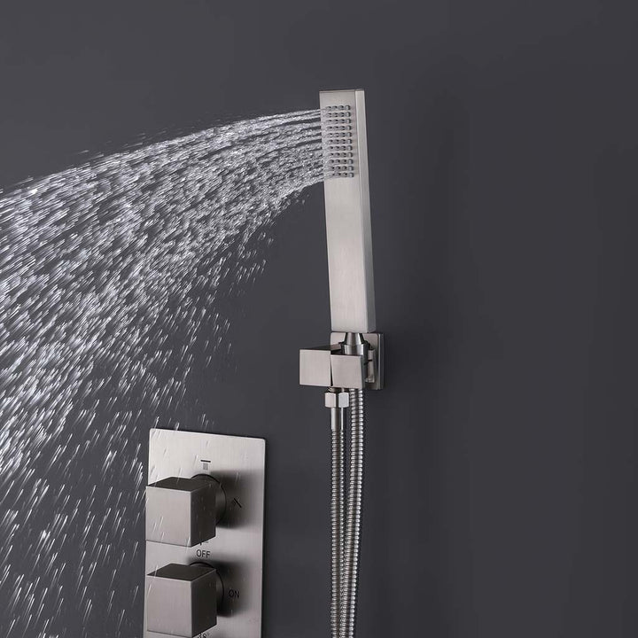 Brushed nickel square handheld shower head with spray in modern bathroom