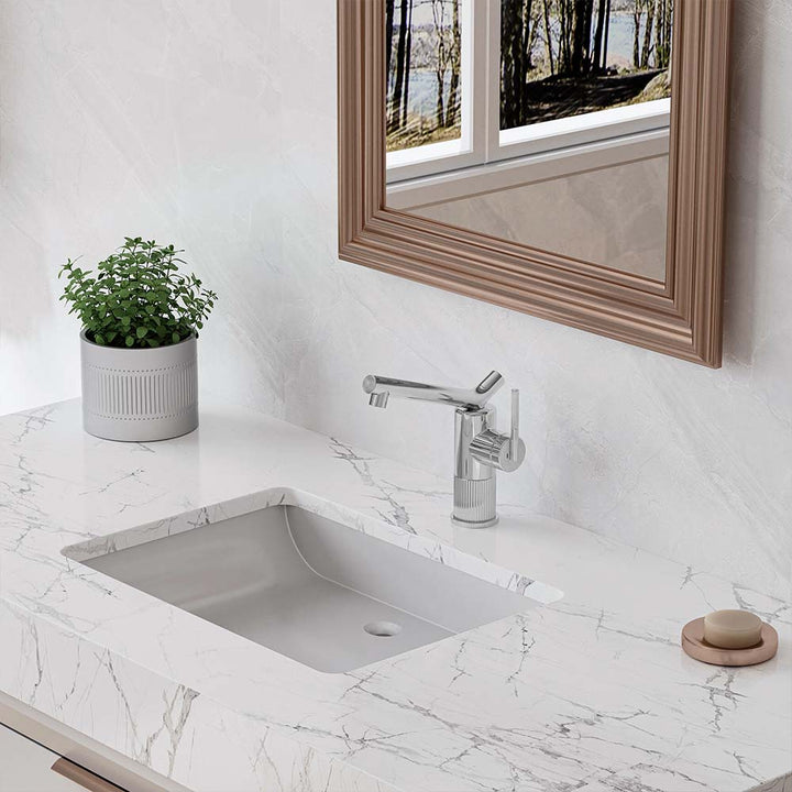 Close-up of chrome bathroom faucet on marble vanity