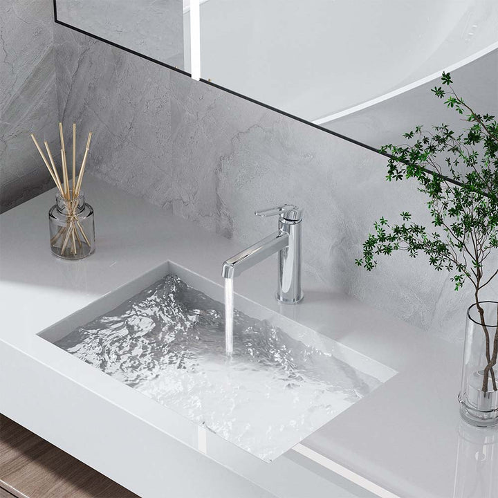 Chrome faucet running water into sink on modern vanity