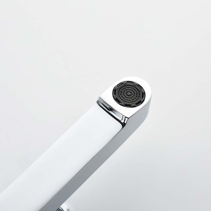 Close-up of chrome faucet aerator on white background