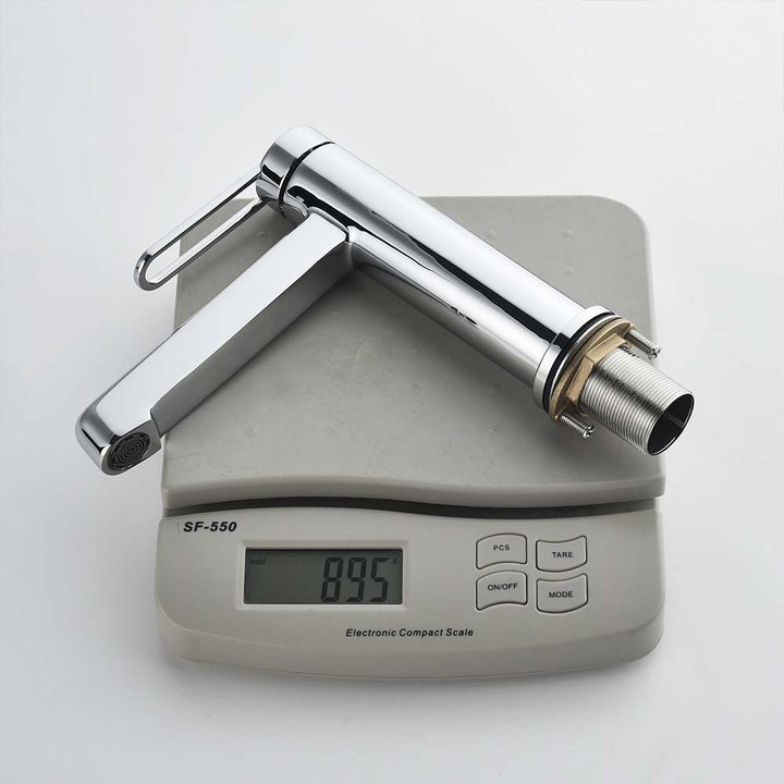 Chrome faucet weighing 895g on digital scale