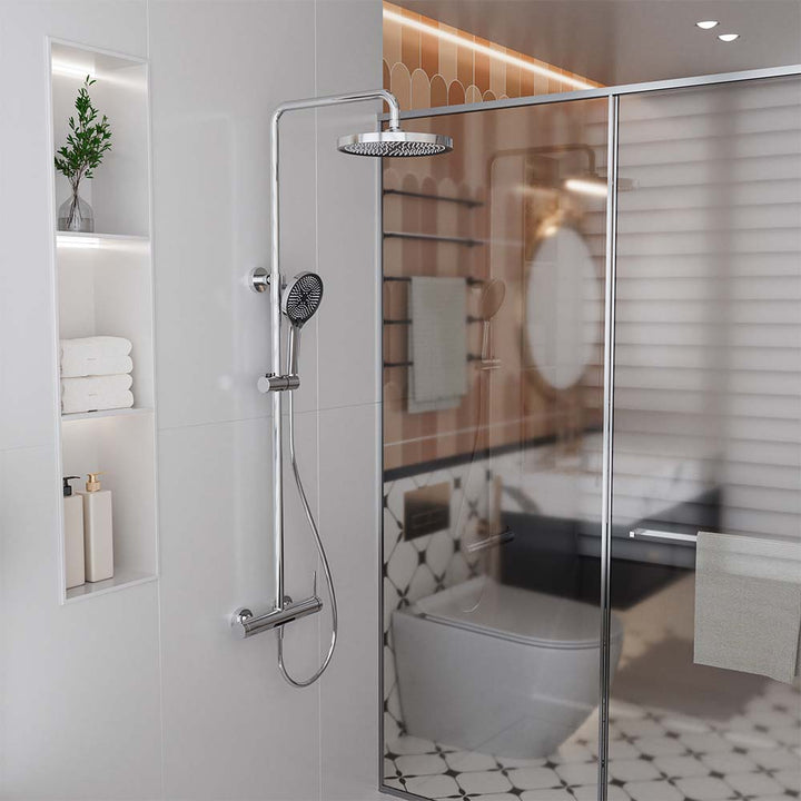 Chrome shower system with rainfall showerhead installed in bathroom