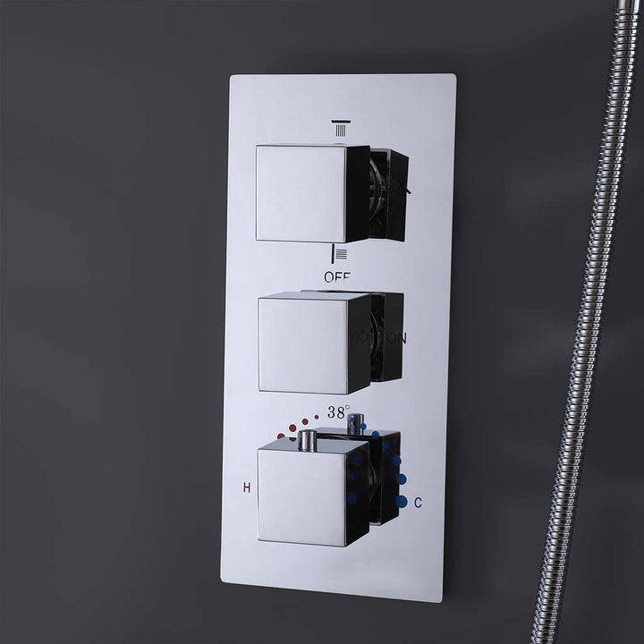 Chrome shower system thermostatic control valve panel closeup view
