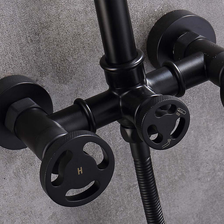 Close-up of black tub faucet knobs