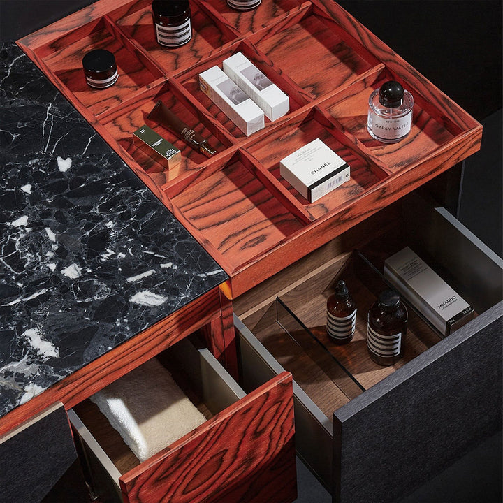 Custom bathroom vanity with black marble top and red wood organizer drawers