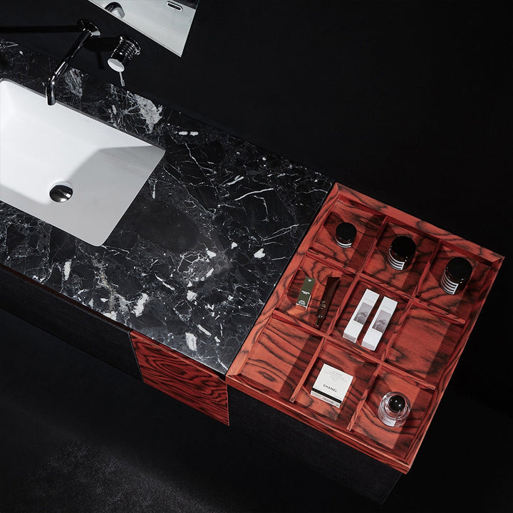 Custom bathroom vanity with black marble top and red drawer detail