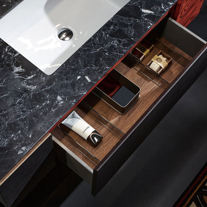 Custom bathroom vanity with black marble top and wood drawer detail