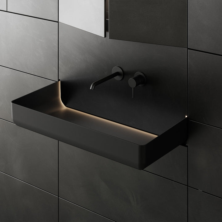 Close up of dark gray custom bathroom vanity with wall mounted sink design