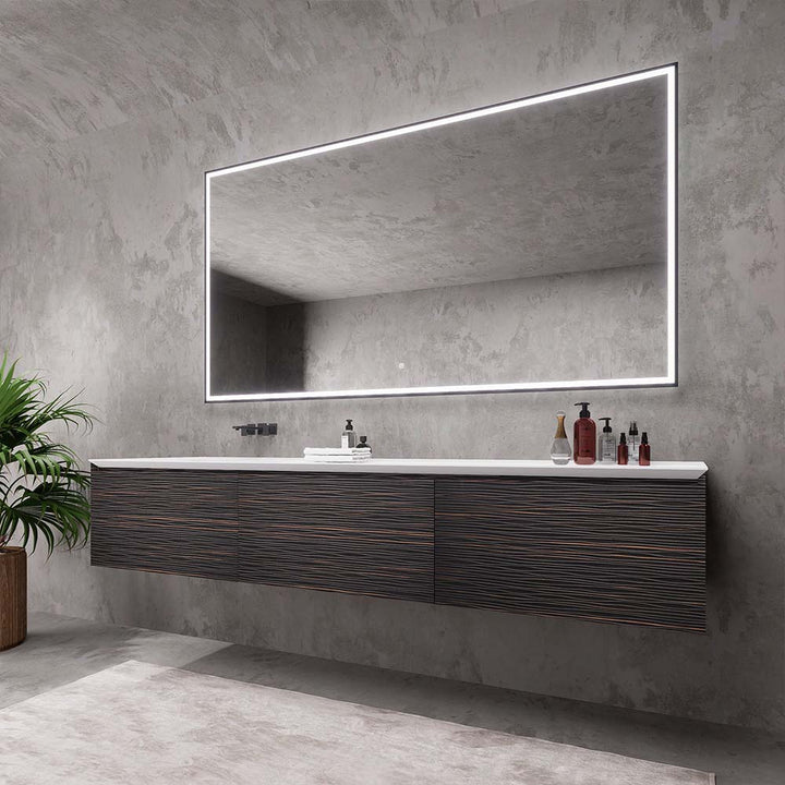 Side view of dark wood custom bathroom vanity with LED mirror