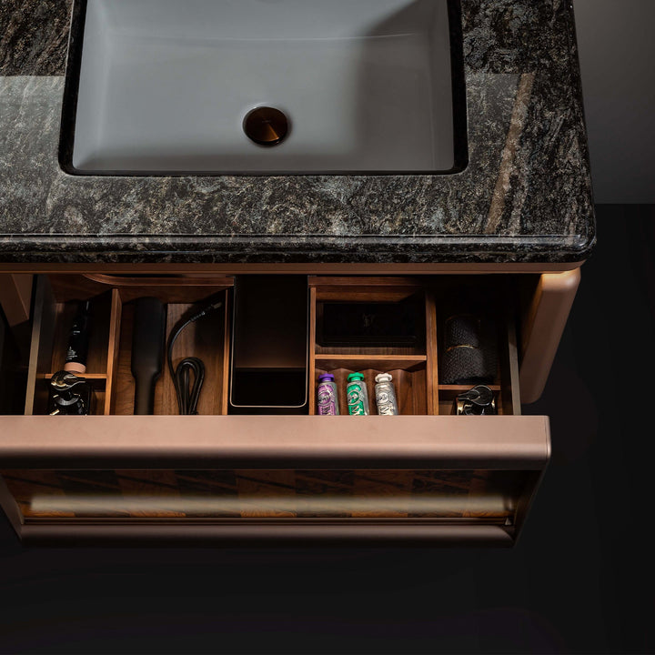 Custom bathroom vanity with marble top and organized drawer storage