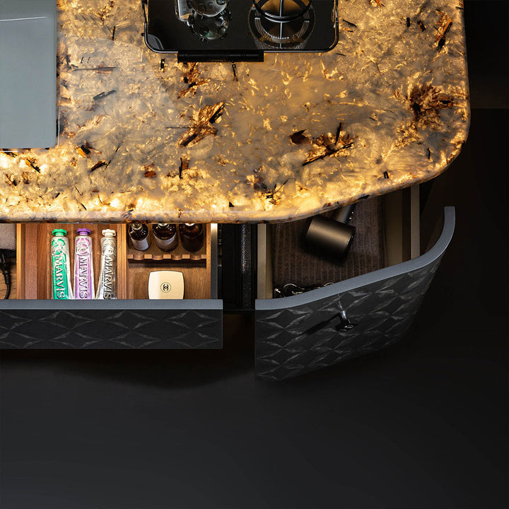 Custom bathroom vanity with lighted onyx countertop and drawer detail