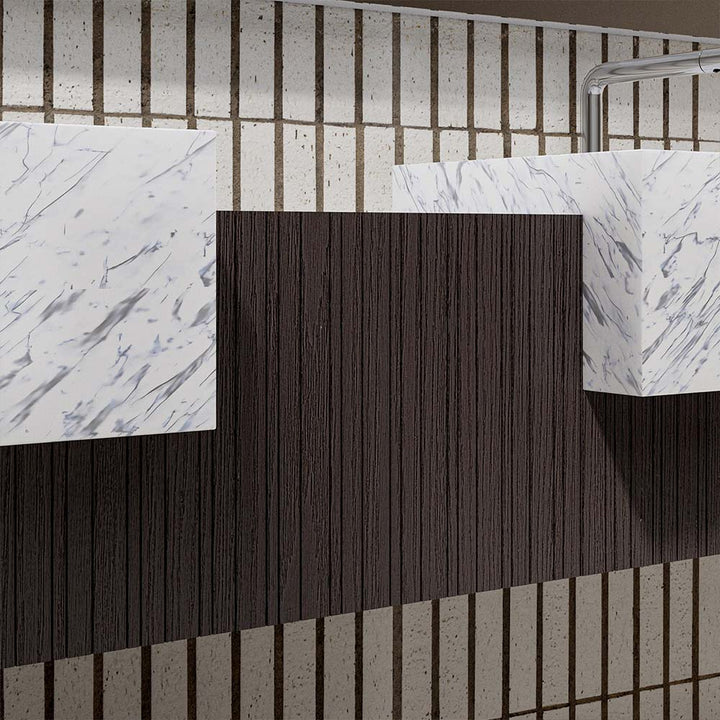 Marble basin and dark wood detail closeup of custom bathroom vanity