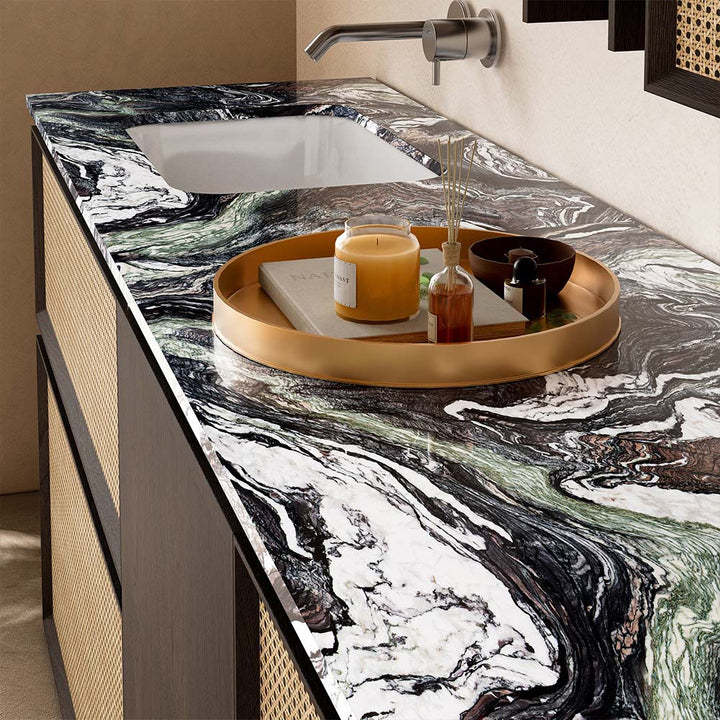 Marble countertop detail with sink on custom bathroom vanity