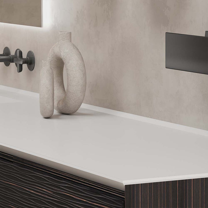 Detail of custom bathroom vanity with white countertop and decor