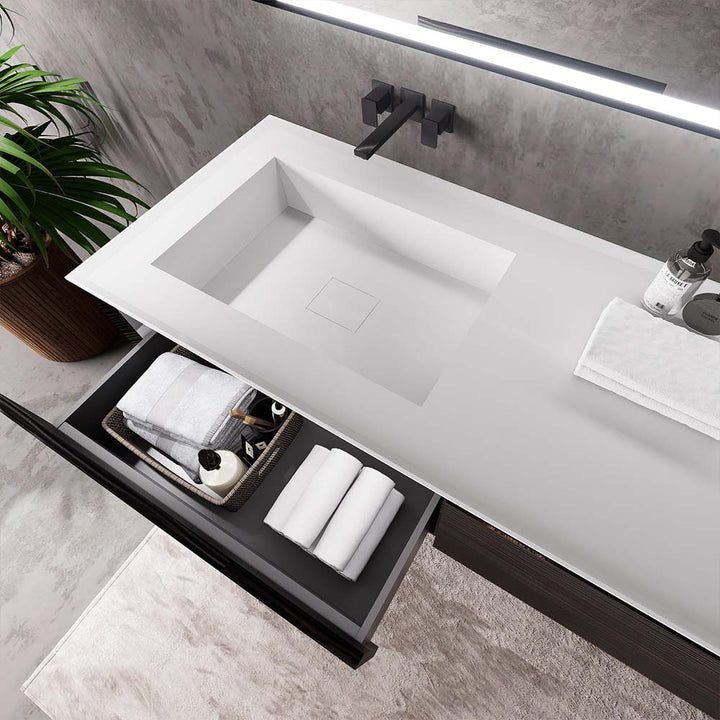 Detail of custom bathroom vanity with white sink and drawer storage