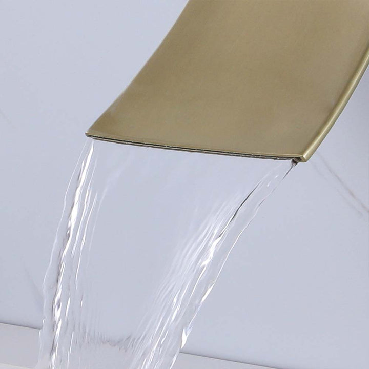 Modern brushed gold bathroom faucet with water flow close-up
