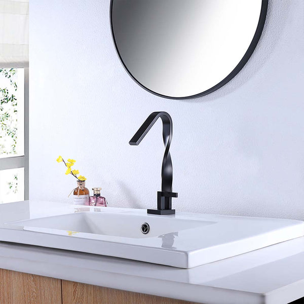 Black twisted faucet on white vanity with round mirror above