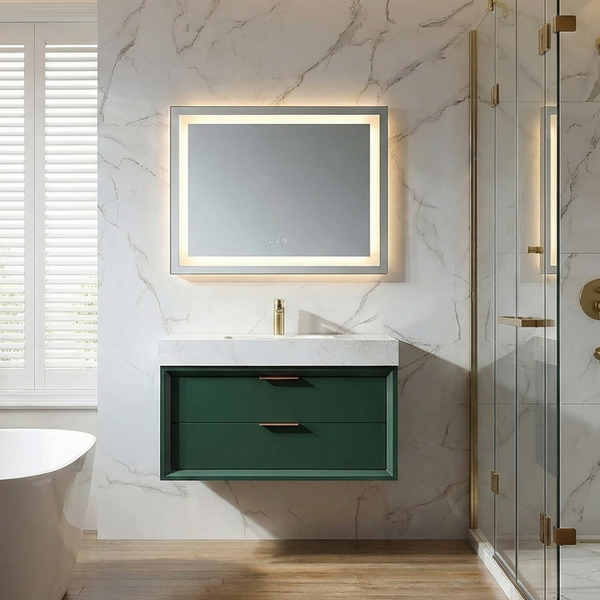 Floating green bathroom vanity with two drawers, white marble countertop, brass faucet, and a backlit LED mirror in a modern marble-look bathroom