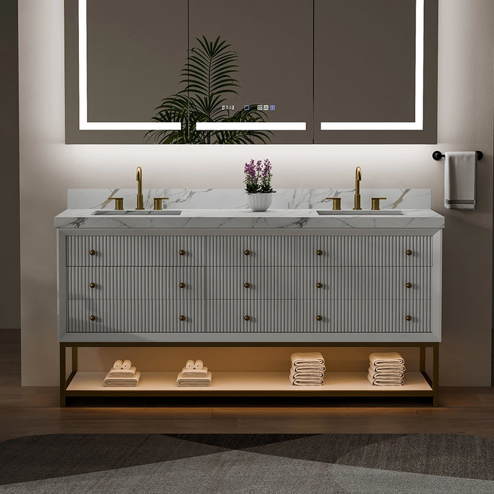 White fluted solid wood bathroom vanity with marble top and warm lighting