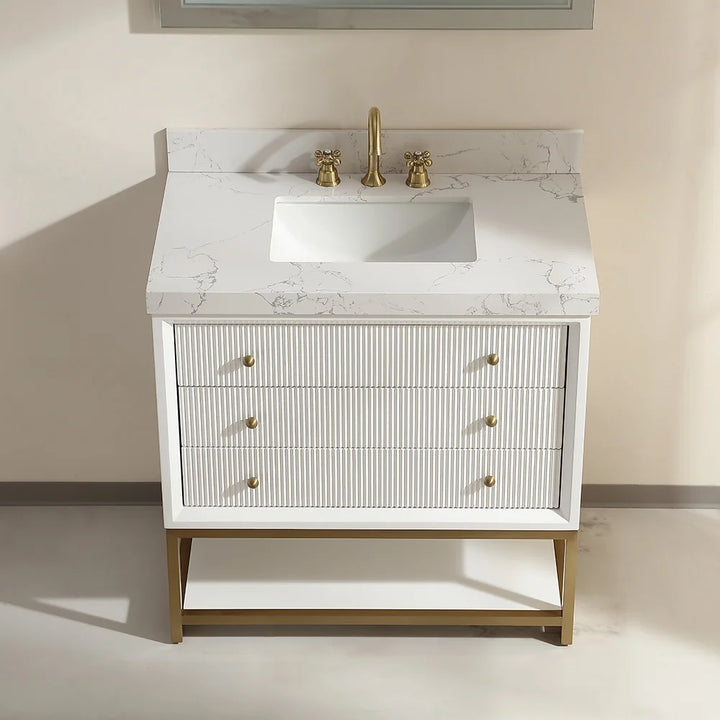 Top view of white fluted solid wood bathroom vanity with marble sink and gold faucet