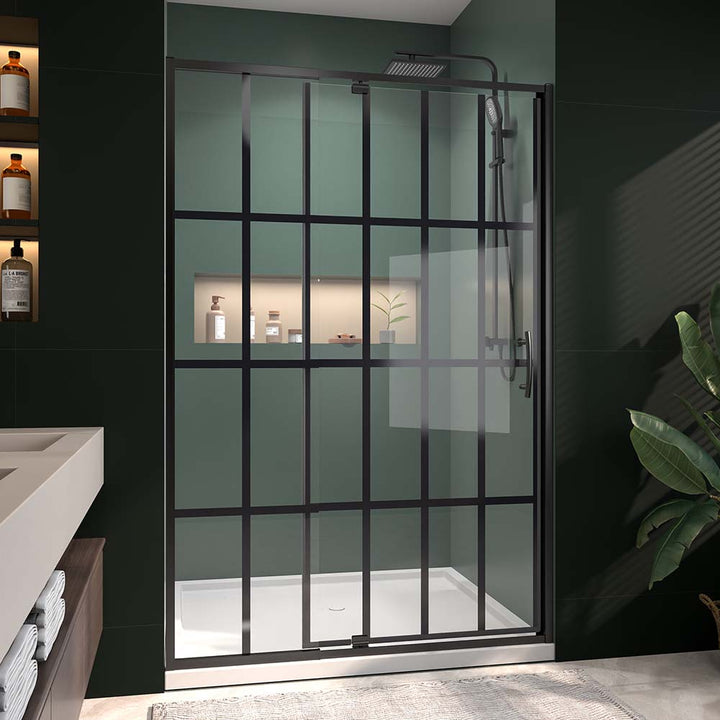 Framed pivot shower door in modern bathroom with green wall