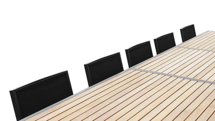 Close-up of FSC Teak Aluminum Dining Table with Six Black Chairs on One Side