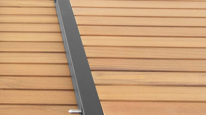 Close-up of FSC teak outdoor dining table joint showing smooth slat and frame connection