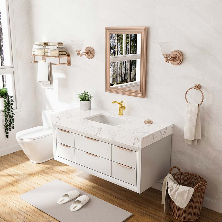 Modern gold faucet installed in luxury white bathroom with vanity
