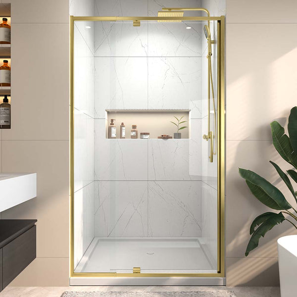 Modern gold framed glass shower door in marble bathroom